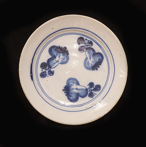 A blue decorated faience plate. Signed Copenhagen 
circa 1740. D: 21,5cm