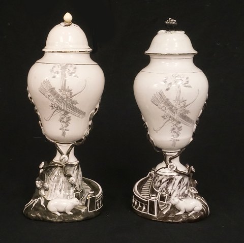 Two in sepia decorated 18th century rabbit faience 
vases. Signed Marieberg, Sweden, circa 1775. H: 
34,5cm