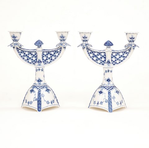Royal Copenhagen: A pair of blue fluted full lace 
candelabra 1169. H: 25,5cm. W: 21cm