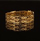 Leddelt armbånd i 18kt guld. L: 20cm. V: 27,9gr
