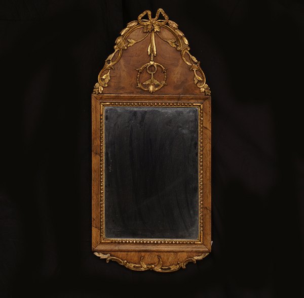 A small Louis XVI gilt walnut veneered mirror. Denmark circa 1780. 67x31cm