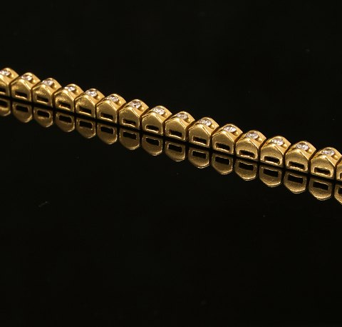 Tennisarmbånd, 18kt guld, med 57 diamanter. L: 19,5cm