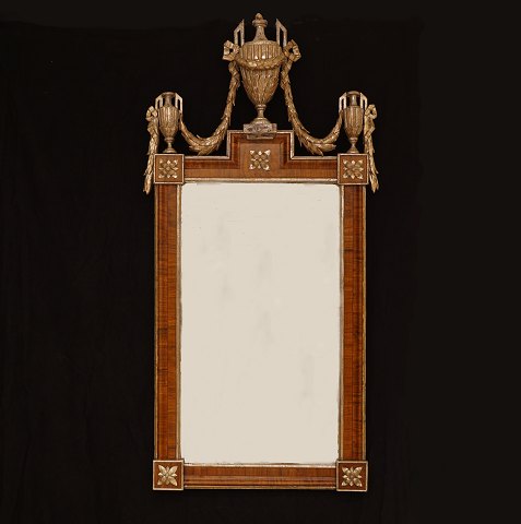 A large Louis XVI mirror richly carved. Denmark 
circa 1780. Size: 123x62cm