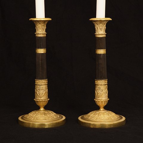 A pair of Empire gilt bronze candelsticks. France circa 1830. H: 28cm