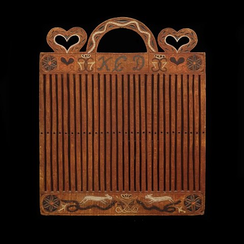 A Danish 19th century rigid heddle. Dated 1825. H: 
32cm. W: 26cm