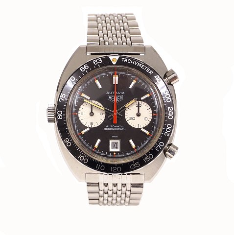 Heuer Autavia, Stahl, Ref. 1163, sogenannte "Derek 
Bell" nach dem britischen Formel 1-Fahrer. Wird 
mit originalem Armband, "beads-of-rice", 
geliefert. Um 1970. D: 42mm