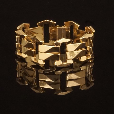 Leddelt armlænke i 18kt guld med kasse- og sikkerhedslås. L: 20cm. V: 34,5gr