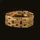 Christian H. Lorenzen, Charlottenlund, Denmark: A 14kt gold bracelet. L: 19cm. 
W: 10mm. W: 22,9g