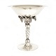 A Georg Jensen Art Noveau Sterlingsilver grape tazza. Made 1918-30. #264. H: 
27cm. W: 1.125gr