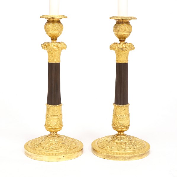 A pair of gilt Bronze candelsticks. France circa 1810-20. H: 33cm