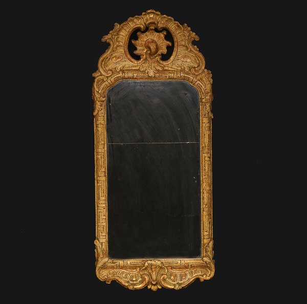 A gilt 18th century Rococo mirror. Sweden circa 1760. H: 76cm. W: 33cm