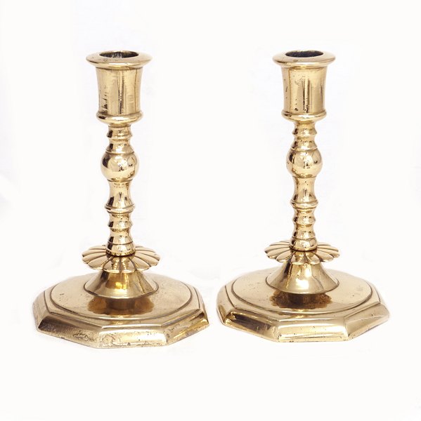 A pair of mid 18th century brass candle sticks. Denmark circa 1750. H: 15cm