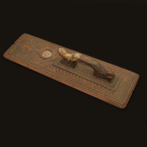 Wood carved mangle board with mermaid handle. Denmark 17th century. H: 55cm