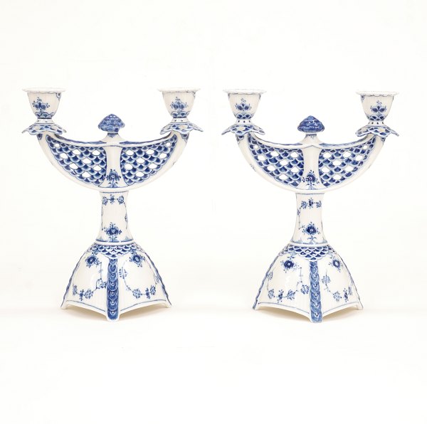 Royal Copenhagen: A pair of blue fluted full lace candelabra 1169. H: 25,5cm. W: 
21cm