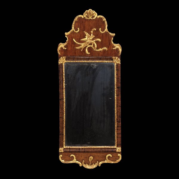 A gilt mahogany and walnut mirror. Denmark circa 1770. Size: 80x31cm
