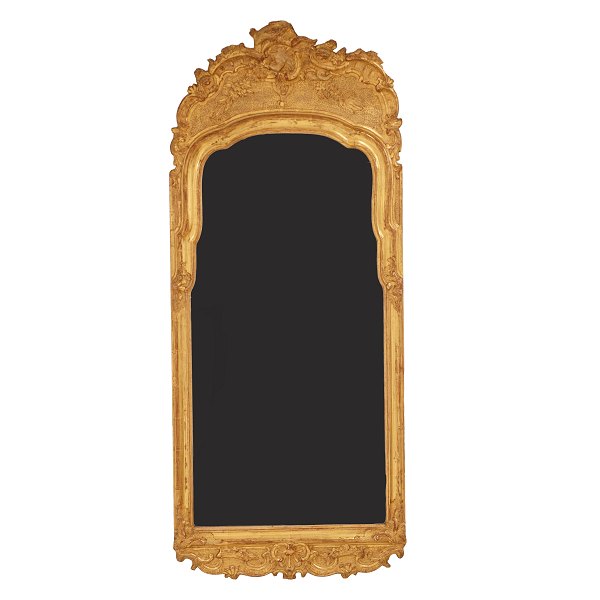 A gilt wood cut Rococo mirror. Sweden circa 1770. Measures: 125x53cm