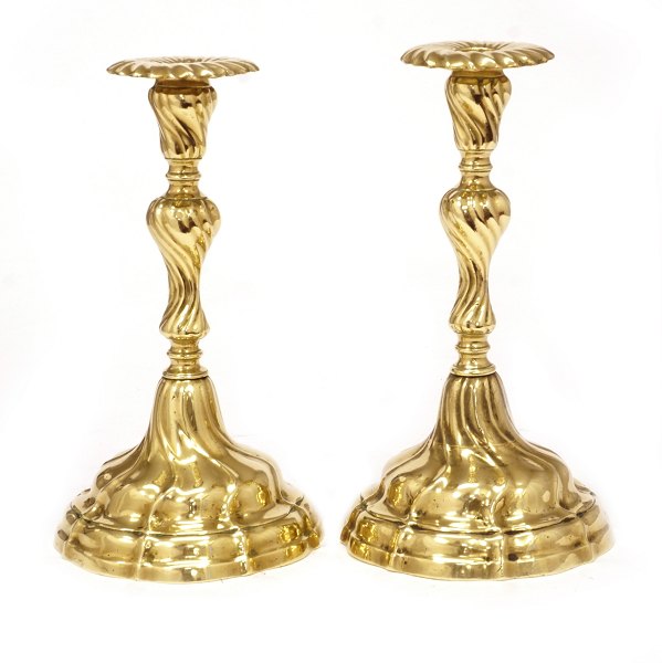 Pair of Rococo brass candlesticks. Circa 1760. H: 23cm